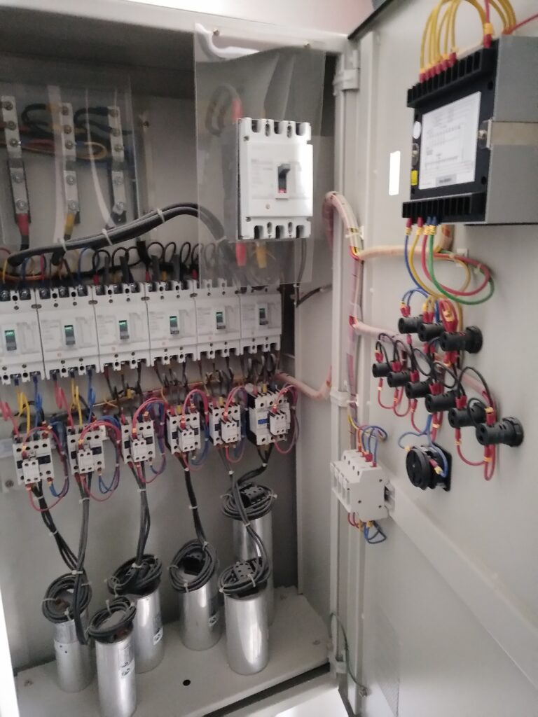 Electrical contractor install new capacitor bank panel