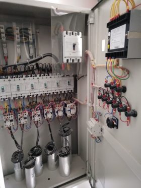 Electrical contractor install new capacitor bank panel